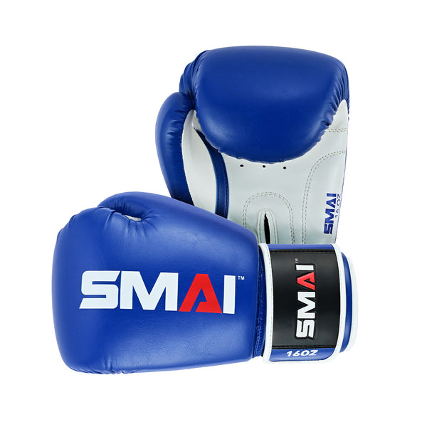 A pair of Essentials Boxing Glove - Blue by SMAI, featuring bold "SMAI" branding. One glove shows the front; the other reveals the palm, wrist strap, and "16OZ" marking.