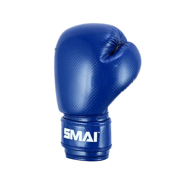 The PRE ORDER: Essentials Kids Boxing Glove - Blue by SMAI is a single blue glove with "SMAI" in white on the wrist strap, providing reliable wrist support, displayed against a plain white background.