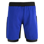 The SMAI Hybrid MMA Grappling Shorts in black and blue feature a fitted underlayer extending below the main shorts, with a black waistband and side panels. Durable training shorts are shown on a plain white background.