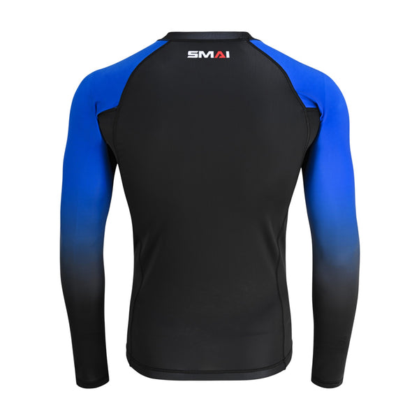 Back view of the SMAI Long Sleeve Rash Guard - Blue: black body with blue sleeves fading to black at the wrists, "SMAI" near the collar. Designed for no-gi grappling and made with compression technology.