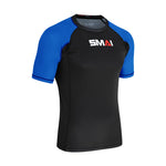 The SMAI Short Sleeve Rash Guard - Blue features a black body with blue sleeves and the signature SMAI logo on the chest, making it perfect for no-gi grappling sessions.