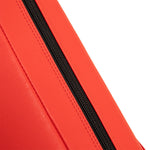 A close-up of a vibrant orange leather bag with a black vertical zipper highlights its quality material and design, reminiscent of SMAI's Boxing Ring Corner Pads made from durable vinyl, akin to medium density foam padding in athletic gear.