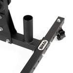 Close-up of the SMAI Bumper Plate & Barbell Storage Tree with Wheels, showing its black metal base, vertical cylindrical barbell holder, crossbar with bolted joints, branded "SMAI" plate, and caster wheel on a white background.
