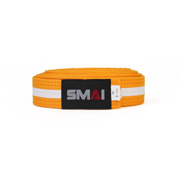 A durable orange martial arts belt made from poly-cotton, featuring SMAI's black patch with white and red text, is folded on a plain white background.