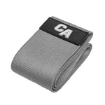 The SMAI Combine Air Knitted Mini Band Light in grey features a folded polycotton design and a black patch with white "CA" letters, providing light resistance for versatile workouts.
