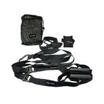 The SMAI The Yard - Suspension Trainer - GTS set features black straps with handles, adjustable loops, metal clips, a mesh bag, and two "THE YARD" ankle/wrist straps—ideal portable gear for functional strength training.