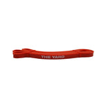 The SMAI The Yard Exercise Resistance Band (10lb/4.5kg) in red features its bold white logo, displayed against a plain white background.
