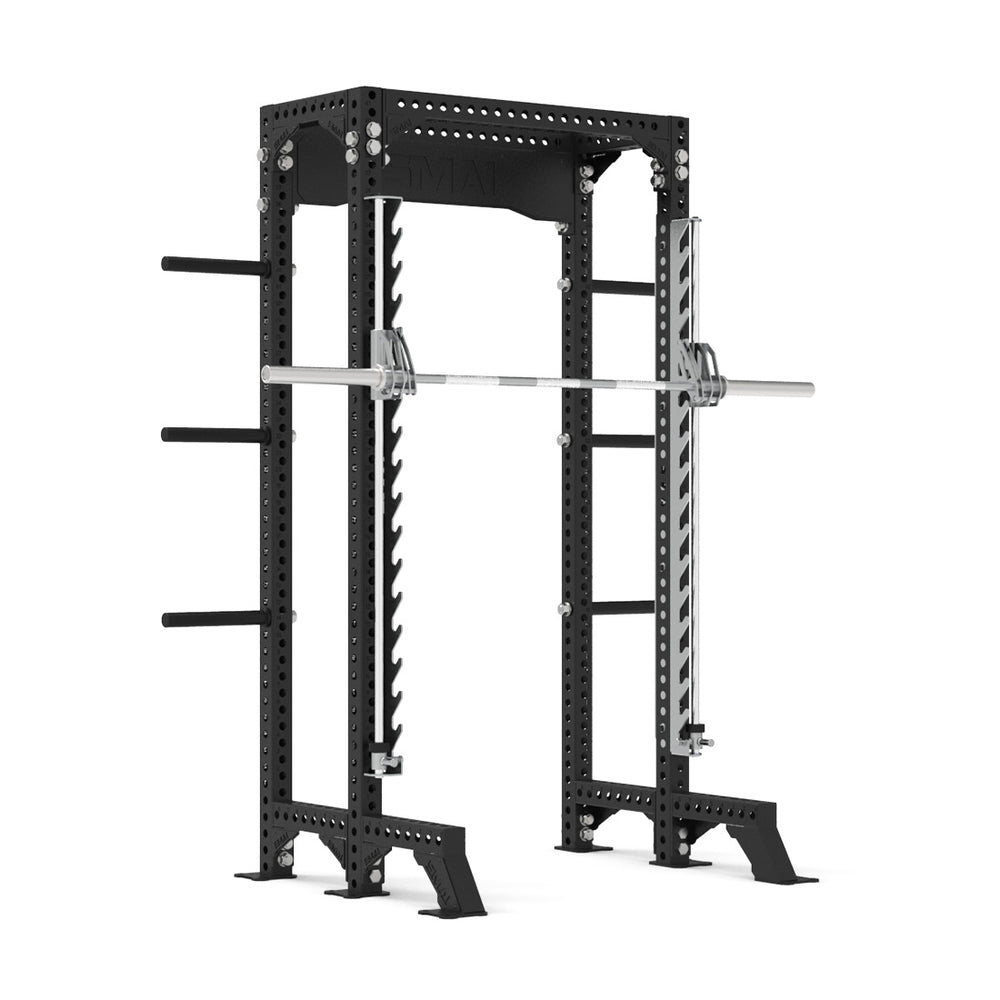 The SMAI Half Power Rack with Smith Machine from the Vanta Series features a durable black frame with numerous holes for adjustable height settings and handy side pegs for organizing weights, highlighting its adaptable design. A barbell is securely positioned on the safety pins inside the rack, embodying the strength of the Vanta Series.