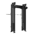 Introducing the SMAI Functional Trainer Dual Cable Stacks & Smith Machine from the Vanta Series, a sleek black adjustable power rack featuring multiple holes and attachments. It comes with a silver horizontal barbell in the center. This compact strength training equipment is designed to fit into smaller spaces and is presented on a white background.