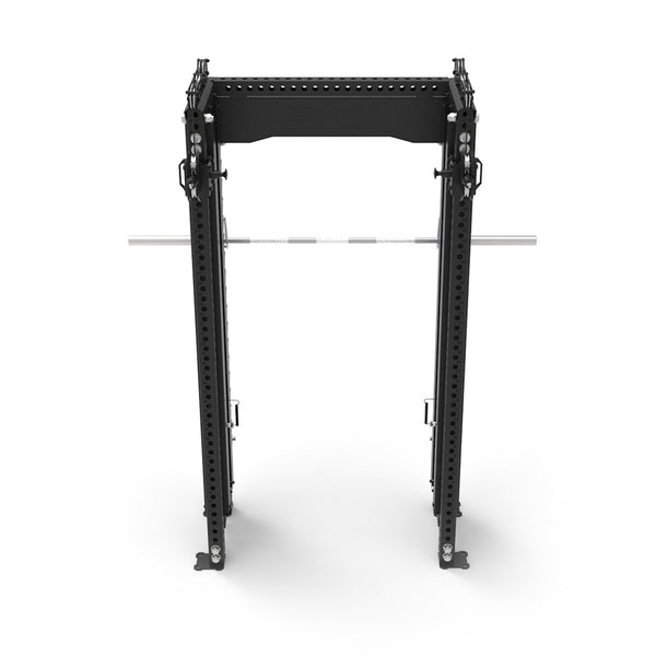 A compact black squat rack from the SMAI Vanta Series, complete with a silver barbell, is positioned in view. This setup resembles the Functional Trainer Dual Cable Stacks & Smith Machine and features multiple adjustment holes for various height settings. The entire setup is set against a plain white background.