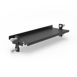 The SMAI Flat Shelf 108cm - Vanta Series is a black metal bracket with two side flanges, four large silver bolts, a flat platform, and a raised edge for security—ideal for power rack storage or commercial gym shelving.