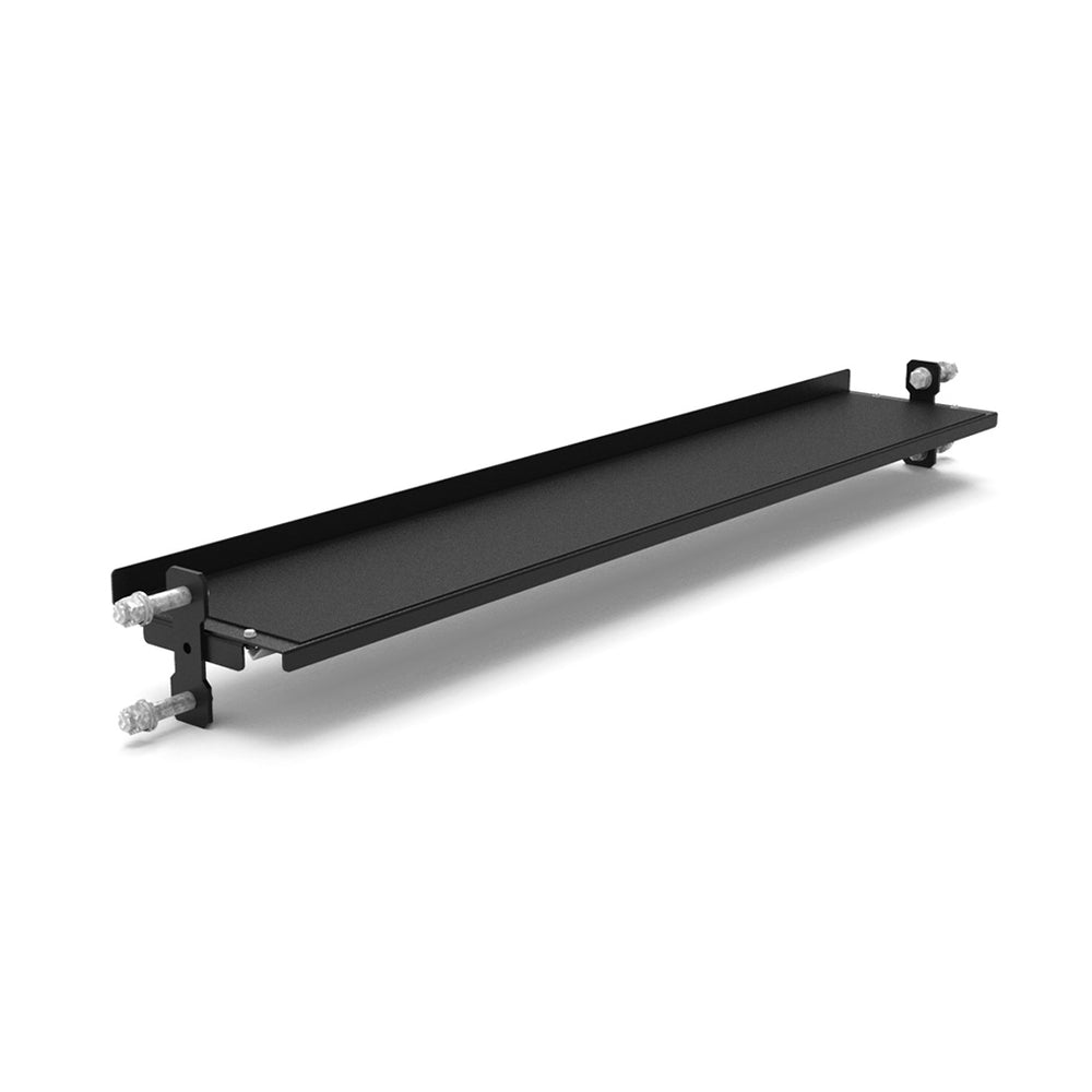 The SMAI Flat Shelf - Vanta Series in black features side brackets and four silver mounting bolts for wall or Power Rack Series attachment, plus a raised back edge for extra support.