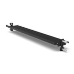 The SMAI Flat Shelf - Vanta Series is a black metal bracket with mounting points and bolts on each end, designed for structural support in the Power Rack Series or as part of a fitness storage shelf. Shown on a white background.