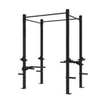 The SMAI The Yard - Rig - 2 Cell is a black metal freestanding squat rig featuring adjustable safety bars, pull-up bars, dip stations, and integrated weight plate storage—perfectly designed for strength training and weightlifting exercises.