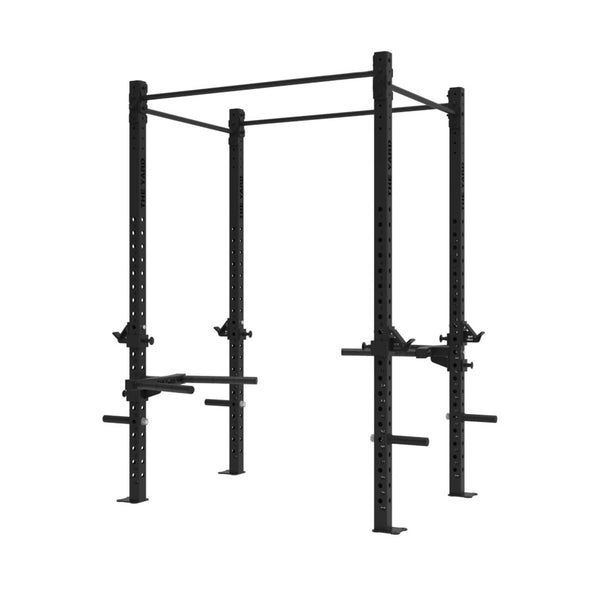 The SMAI The Yard - Rig - 2 Cell is a black metal freestanding squat rig featuring adjustable safety bars, pull-up bars, dip stations, and integrated weight plate storage—perfectly designed for strength training and weightlifting exercises.