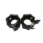 A pair of SMAI The Yard - Barbell - Easy Lock 50mm Collars (black) feature locking levers to securely hold weight plates. These durable collars are shown side by side on a white background.