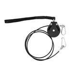 The Yard - Cable Pulley System by SMAI features a black retractable design with a metal pulley, two silver carabiners, and a wrist strap—ideal for strength training or upgrading your home gym. Shown on a white background.