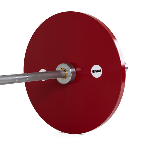 A close-up of SMAI Calibrated Weight Plates - 25kg (Pair) attached to a barbell, showcasing the red plates and SMAI logo on the end of the bar, set against a white background.