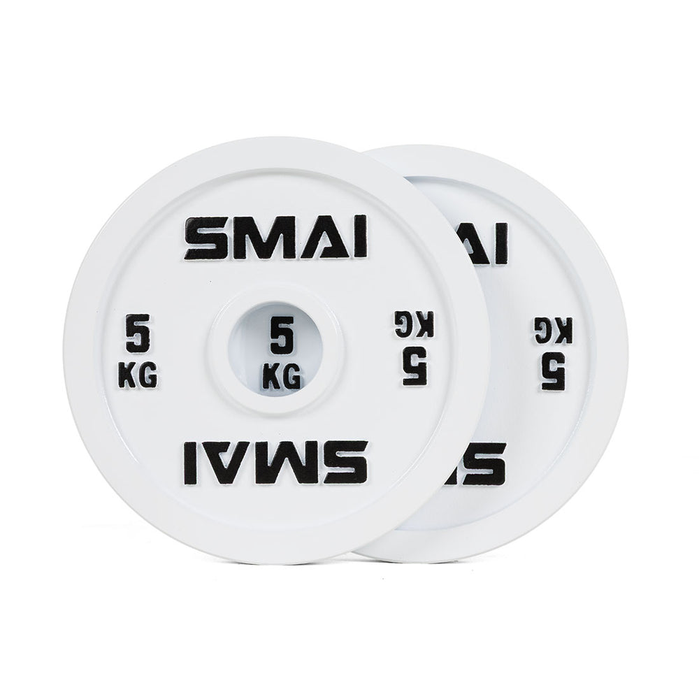 A pair of SMAI Calibrated Weight Plates - 5kg, featuring white cast iron with "SMAI 5 KG" in black text, are stacked together with one plate slightly in front.