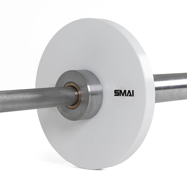 A close-up of a SMAI Calibrated Weight Plates - 5kg (Pair) shows the white plates with precise markings, attached to a barbell with knurled grip—perfect for serious lifters and powerlifting enthusiasts.