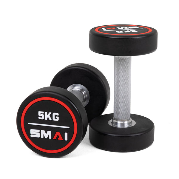 A pair of SMAI Commercial Round CPU Dumbbells, featuring black polyurethane heads, silver handles, and "5KG" labels in white and red text, are displayed on a white background—perfect for any gym setup.