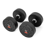 A pair of SMAI Commercial Round Dumbbells, each with a black durable finish and red "15" labels, is perfect for any home gym and displayed on a white surface.