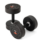 Two SMAI Commercial Round Dumbbells (Pair) with black rubber coating and red-and-white "15" labels are on a white surface—one upright, one lying down—ideal for any home gym setup.