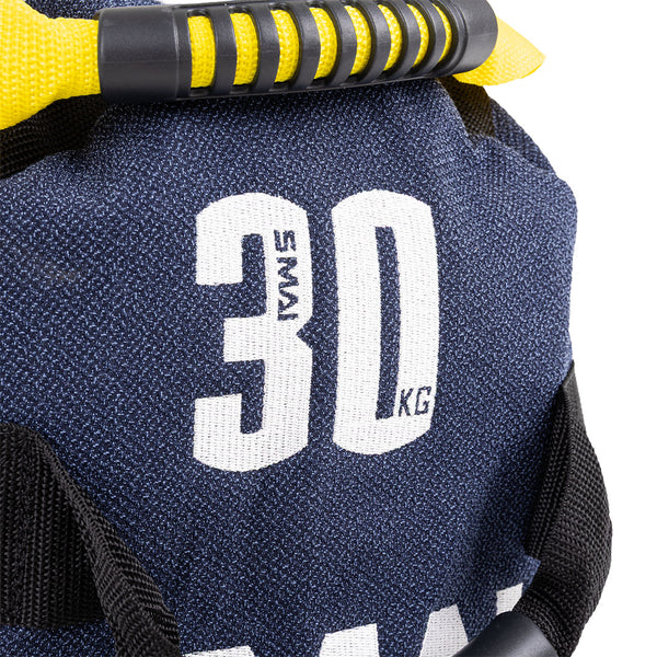Close-up of an SMAI Sand Bags - Hybrid Range in navy blue with "30 KGS" in bold white text. Featuring a yellow and black handle, aramid fibre body, and black side straps—ideal for strength and endurance training.