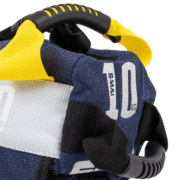 Close-up of the SMAI Sand Bags - Hybrid Range in blue with black and yellow handles, "10 KG" label, and aramid fibre construction. Reinforced stitching boosts durability—ideal for strength and endurance workouts.