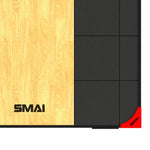 The Weight Lifting Platform 2.0 by SMAI features a black and wooden interlocking mat with the brand name "SMAI" printed in black on the wood surface. It is perfect for weight lifting, and a vibrant red corner piece on the right side, also labeled "SMAI," enhances this robust setup.