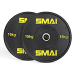 Two weightlifting plates from the Sale Item's HD Bumper Plates Set - 140kg Mixed, each black with "SMAI" marked in yellow and labeled as "15 kg," are stacked against each other on a white background. Crafted from high-grade rubber, these plates are essential gym equipment for serious lifters.