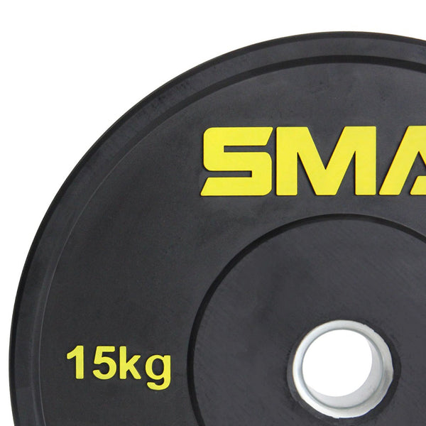 A close-up of the SMAI HD Bumper Plates (Pair) - 15kg, a gym essential made from high-density rubber with a silver center hole and "15kg" in yellow on the left side.