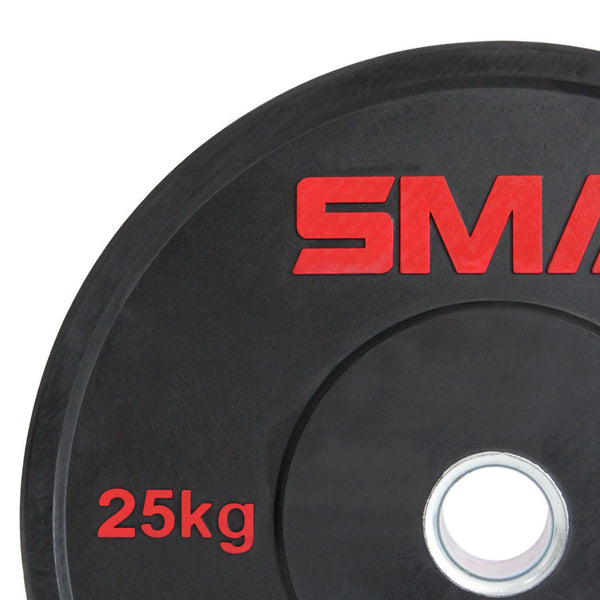 Close-up of an SMAI HD Bumper Plate (25kg), made from high-density virgin rubber. The black plate features "25kg" and part of the SMAI logo in red, with a central hole for easy barbell mounting—ideal for home gyms.
