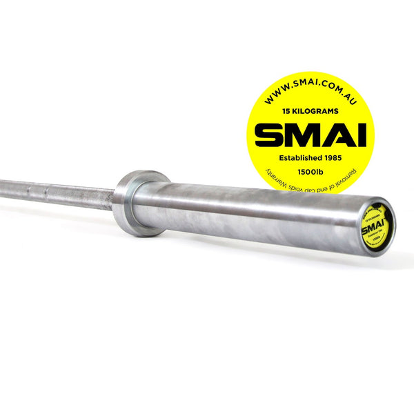 A close-up of a barbell crafted for Olympic lifting, featuring a circular yellow Sale Item label near one end that highlights "15 Kilograms" and "1500lb." Made from high-quality rubber for durability, the 165kg HD Bumper Plate Set includes this 15kg barbell. The website and "Established 1985" are subtly detailed against the white background.