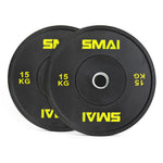 A pair of SMAI Home Gym Bumper Plates - 15kg each, in black with yellow SMAI logo and metal center ring, ideal for home gyms. Plates are shown slightly overlapping.