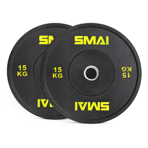 A pair of SMAI Home Gym Bumper Plates - 15kg each, in black with yellow SMAI logo and metal center ring, ideal for home gyms. Plates are shown slightly overlapping.