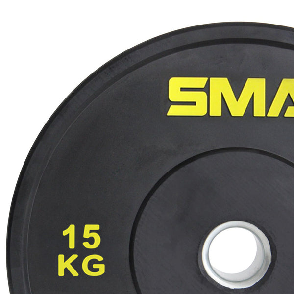 Close-up of affordable SMAI Home Gym Bumper Plates - 15kg (Pair) with yellow "15 KG" text and SMAI branding in the top right. Durable black finish and silver center hole, ideal for any home gym bumper plate setup.