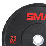 Close-up of an SMAI Home Gym Bumper Plate - 25kg with “25 KG” and part of the SMAI logo in red. This durable plate features a central metal ring, perfect for home gyms seeking affordable SMAI bumper plates.