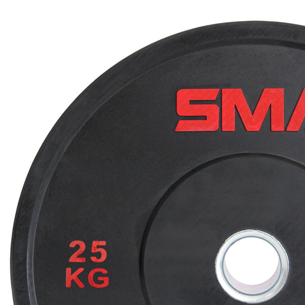 Close-up of an SMAI Home Gym Bumper Plate - 25kg with “25 KG” and part of the SMAI logo in red. This durable plate features a central metal ring, perfect for home gyms seeking affordable SMAI bumper plates.