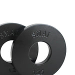 A pair of SMAI Fractional Plate Pair 1.25kg, both in black, are slightly overlapping. Their clean, smooth surface reflects light well, making them perfect for precision in micro-loading.