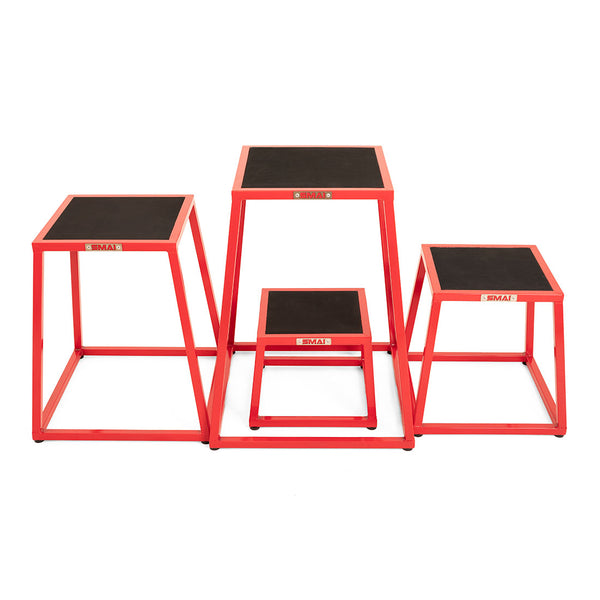 The SMAI Steel Plyo Box Set - 4 Pack Stackable features four red commercial-grade metal boxes with black non-slip tops, shown side by side on a white background.