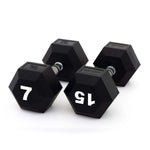 Three black SMAI The Yard - Rubber Hex Dumbbell 7kg pairs are arranged on a white surface, each marked "7 KG" in bold white numbers and designed with an ergonomic grip for comfortable commercial gym use.