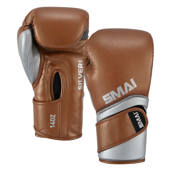 A pair of SMAI Silver Series Boxing Glove - Brown/Silver, with one showing the 14oz palm side and the other showing the branded back, both designed with wrist support.