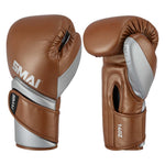 SMAI Silver Series Boxing Glove - Brown/Silver shown from the front and back, featuring 14oz weight and integrated wrist support.