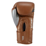 SMAI Silver Series Boxing Glove in brown with silver accents, featuring tri-layer shock protection, “Silver Series” text, and a 14oz label on the wrist.