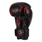 SMAI Essentials Kids Boxing Glove - Red/Black Dragon featuring a red paint-splatter pattern on black gloves with a secure wrist strap.