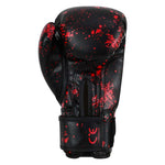 SMAI Essentials Kids Boxing Glove - Red/Black Dragon, featuring black boxing gloves for kids with a red splatter pattern and a wrist strap with CE certification markings.