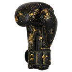 SMAI Essentials Kids Boxing Glove - Black/Gold Dragon featuring a gold paint splatter pattern and a wrist strap labeled “Limited Edition” and “CE.”