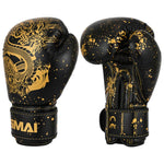 Two black SMAI Essentials Kids Boxing Glove - Black/Gold Dragon gloves featuring gold dragon artwork and gold paint splatter detailing.