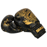 A pair of black Essentials Kids Boxing Glove - Black/Gold Dragon gloves featuring a gold dragon graphic and gold paint splatter detail.